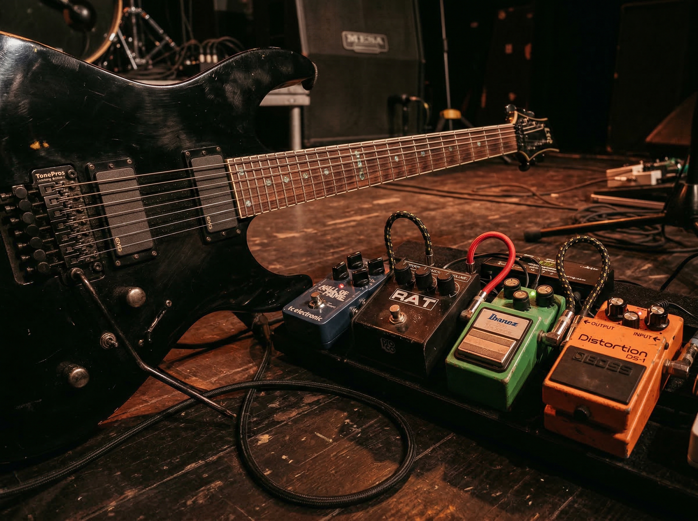 Close-up of an electric guitar with heavy distortion pedal chain for metal music production