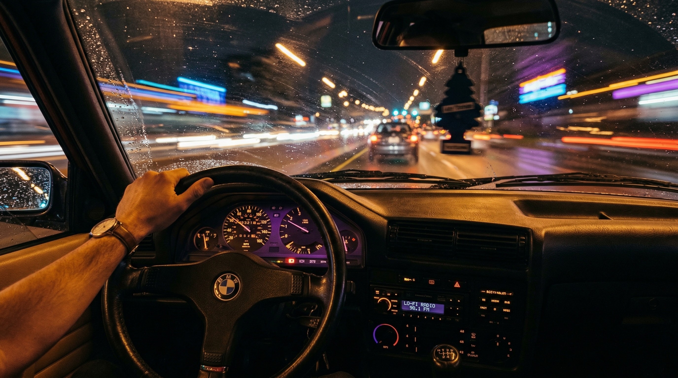 Car interior at night with city lights blurring past the window representing chill phonk driving atmosphere